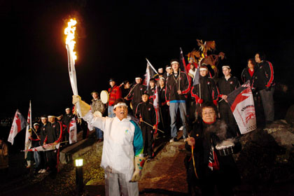 Chief Clarence Louie with Olympic Torch